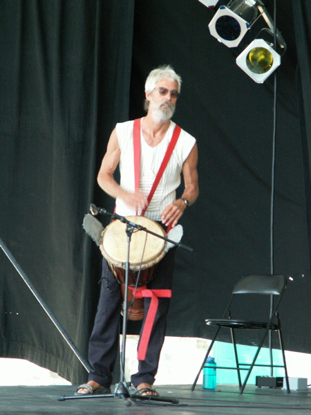 Nowick Gray playing lead djembe at Victoria Folk Festival